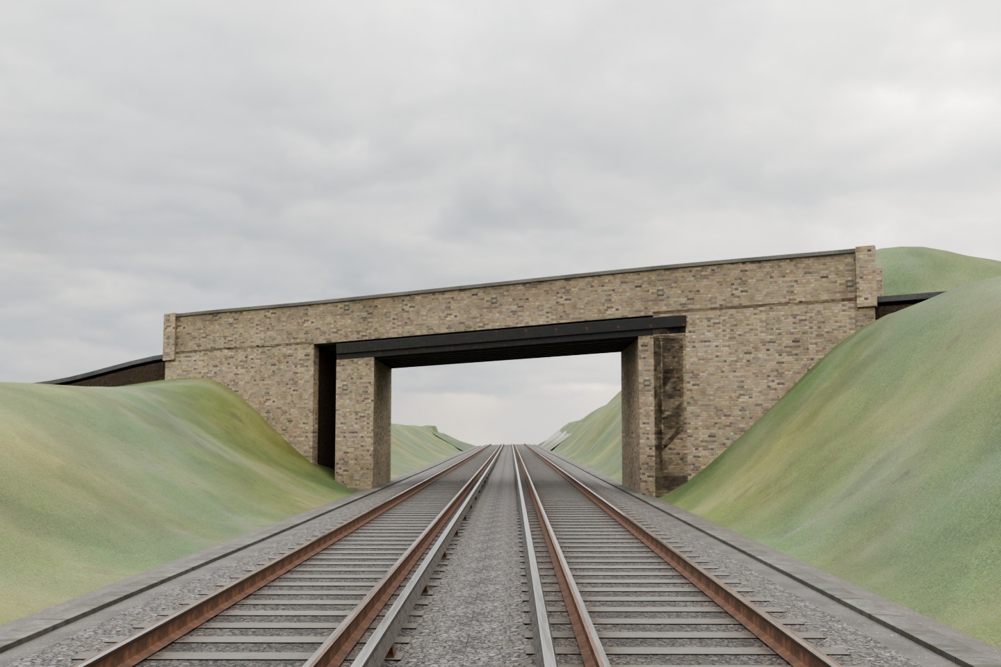 Actual Shallows Road bridge model after bank repair: yellow brick parapet and dark beams above original double railway tracks, with continuous grass cutting banks.