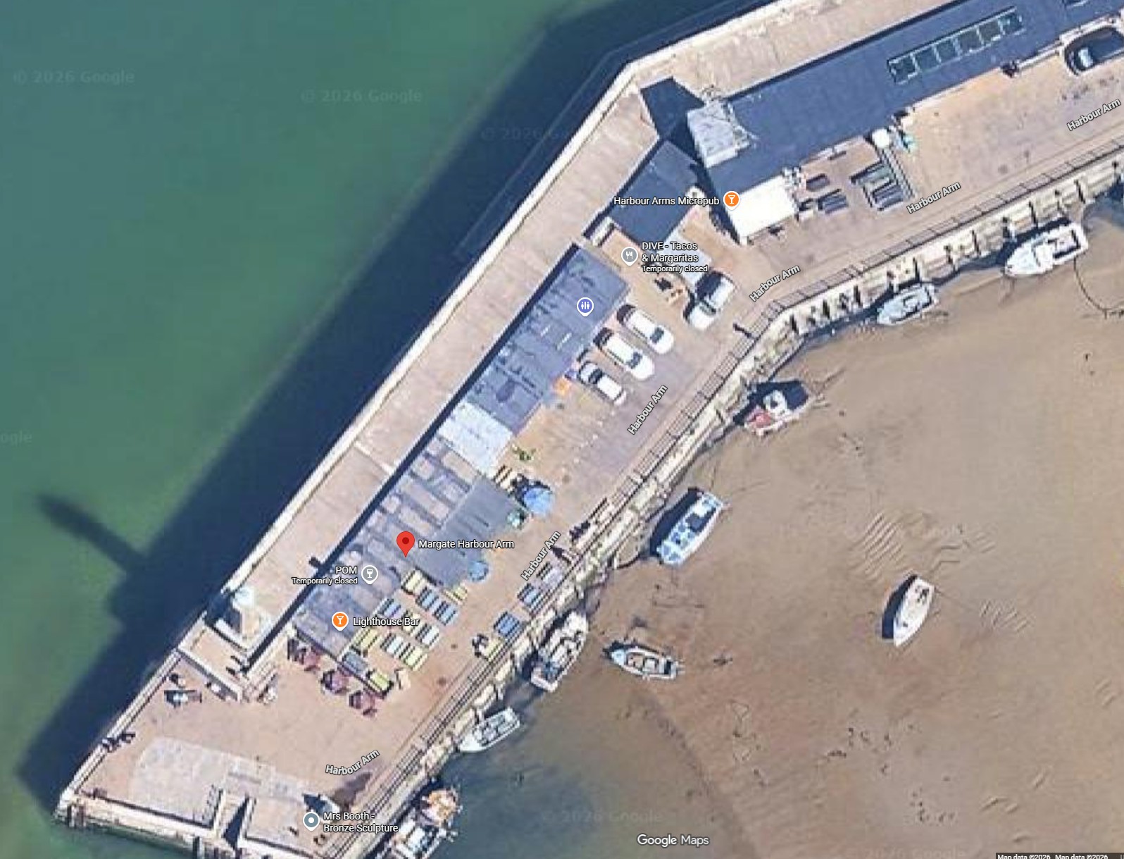 User-supplied Google Maps aerial reference showing the small lookout roof at the bend above the Harbour Arms buildings; Google attribution retained.